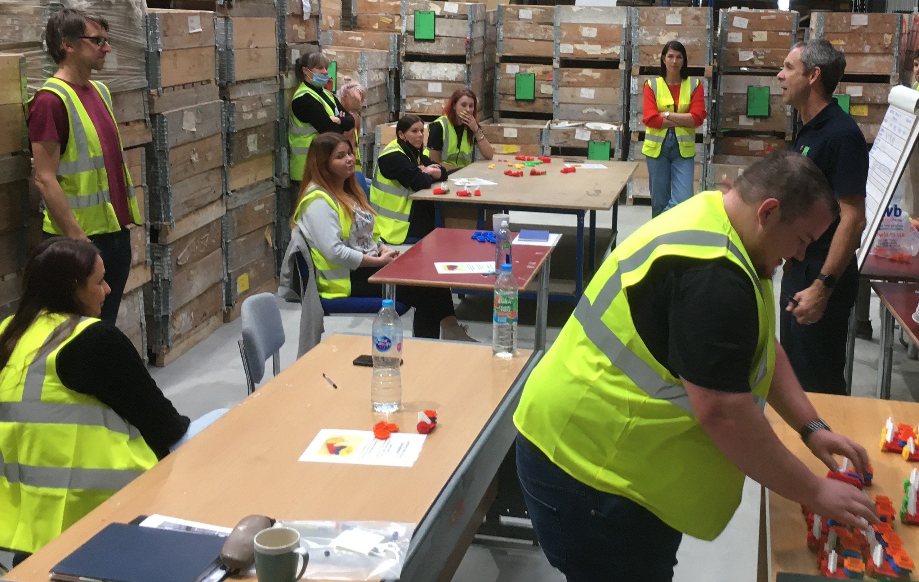 Warehouse team taking part in a lean masterclass workshop activity